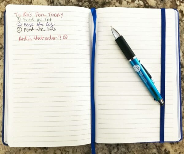 pwc notebook and pen in use with a todo list 1200h pwc notebook and pen in use with a todo list 1200h